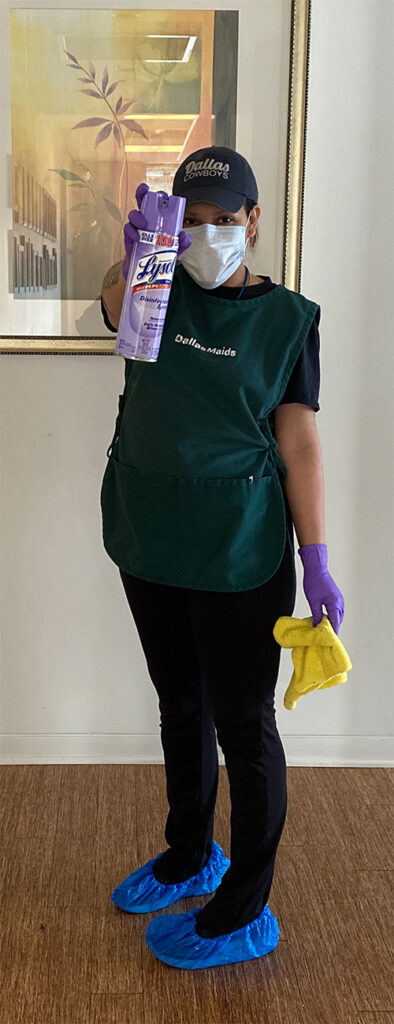 Dallas Maids - Cleaner In Hallway